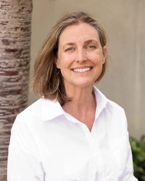 Katherine Heater smiling in a white shirt
